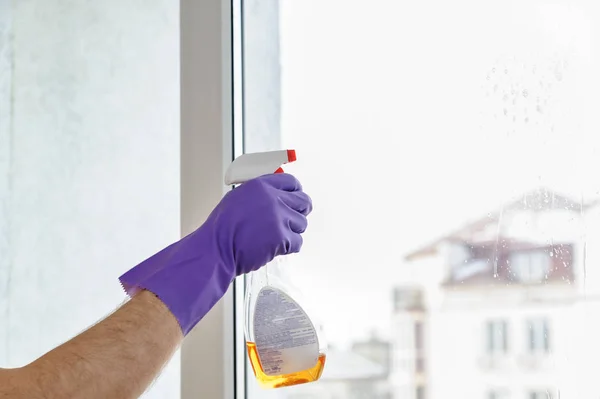 A man cleans the windows.