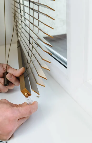 Installing wooden blinds. — Stock Photo, Image