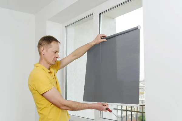 Man with window blind. — Stock Photo, Image