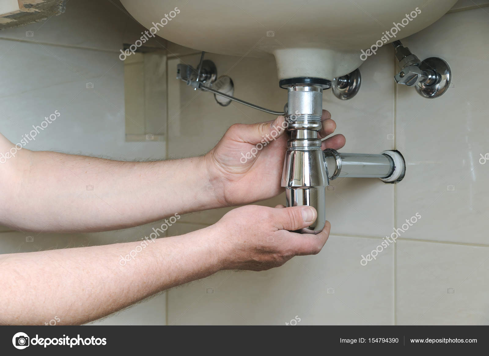 Installing A Chrome Basin Sink Bottle Trap Waste Stock Photo