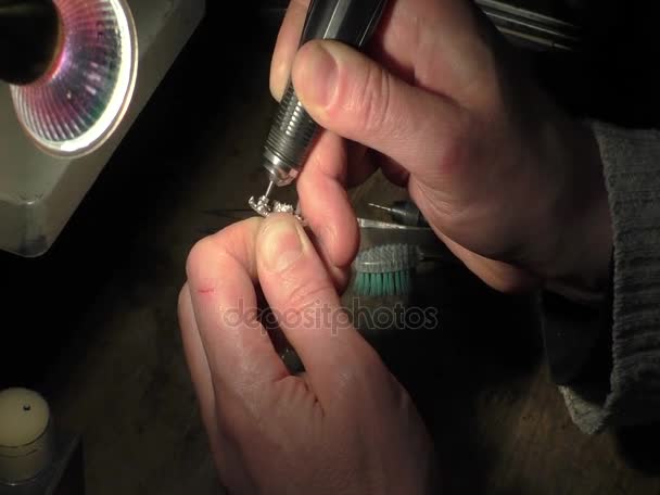 Jeweler is drilling a hole. — Stock Video