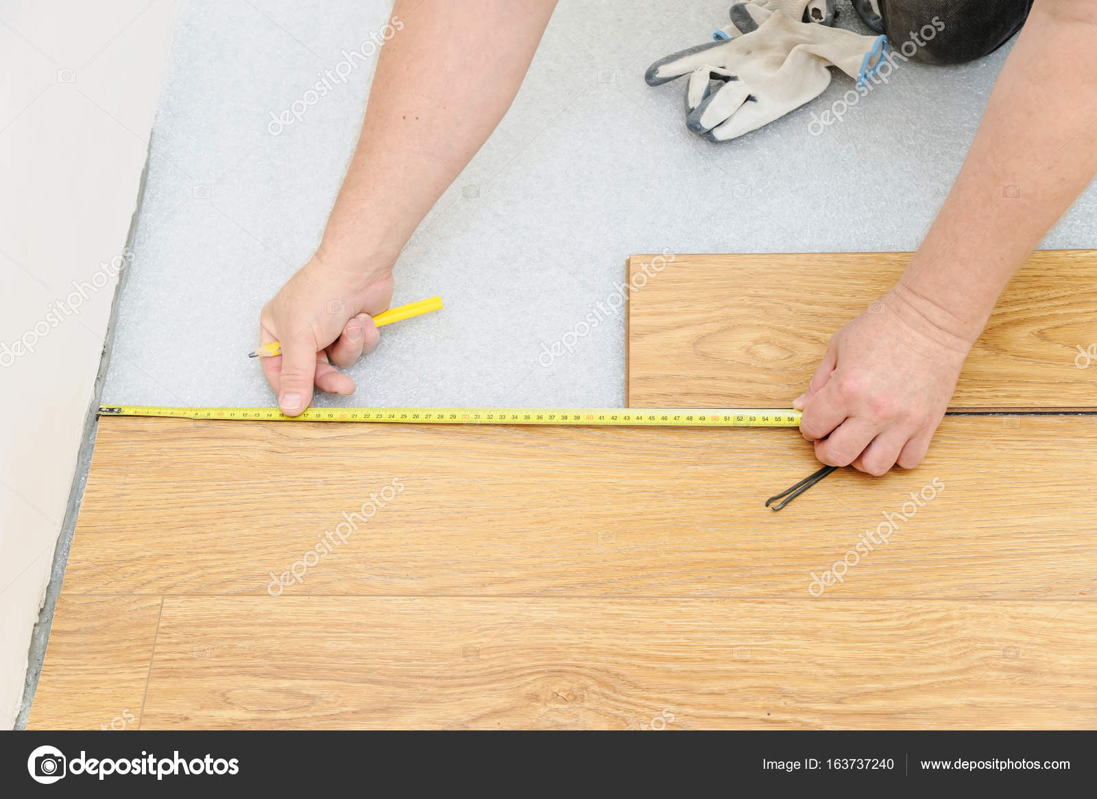 Installation of a laminate floorboard. Stock Photo by ©Yunava1 163737240