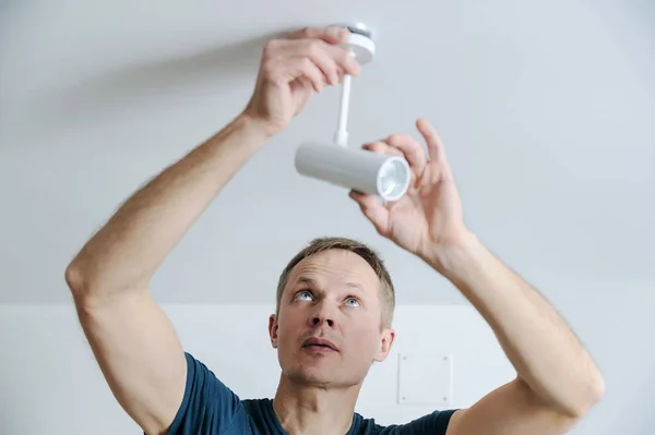 Installing a lamp at home. — Stock Photo, Image