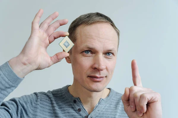 CPU in the man's hand. — Stock Photo, Image