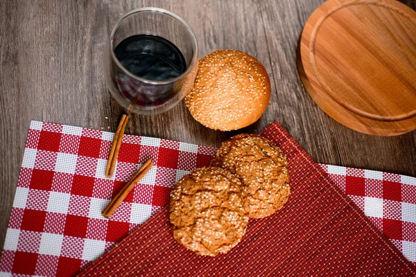 Fresh bread, cookies and coffee on wooden table. — Stock Photo, Image