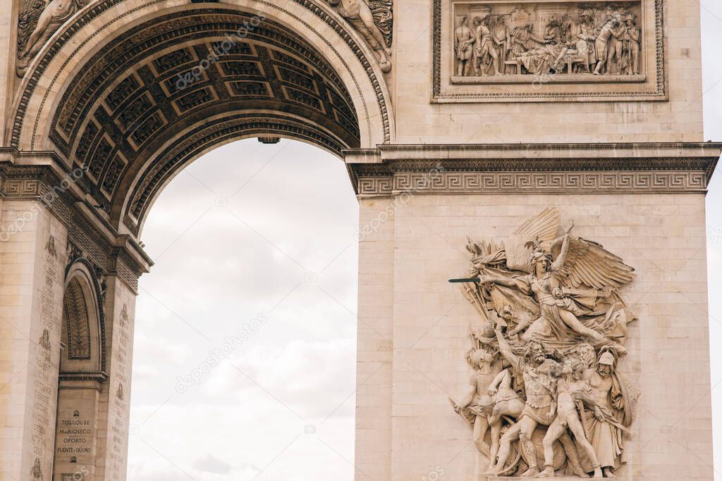 Architectural fragment of Arc de Triomphe. Arc de Triomphe de l'Etoile on Charles de Gaulle Place is one of the most famous monuments in Paris. France.