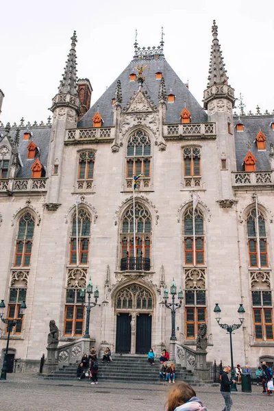 The provincial court building on the Market square in Bruges on a cloudy day