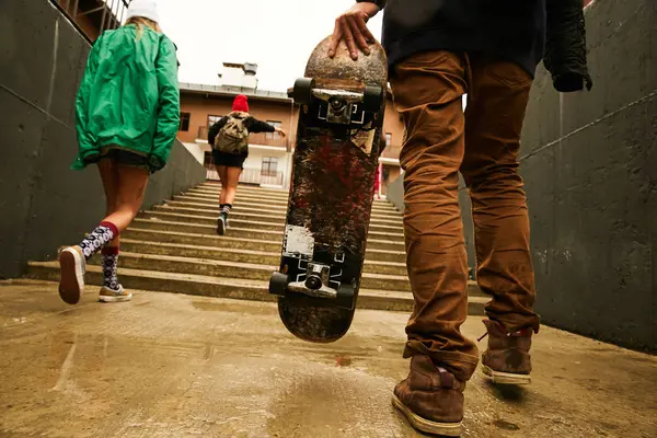 Two women with friend walking on stairs — Stock Photo, Image