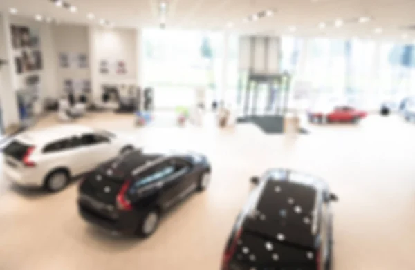 Wazig dealer winkel, met de auto's en zachte lightning — Stockfoto