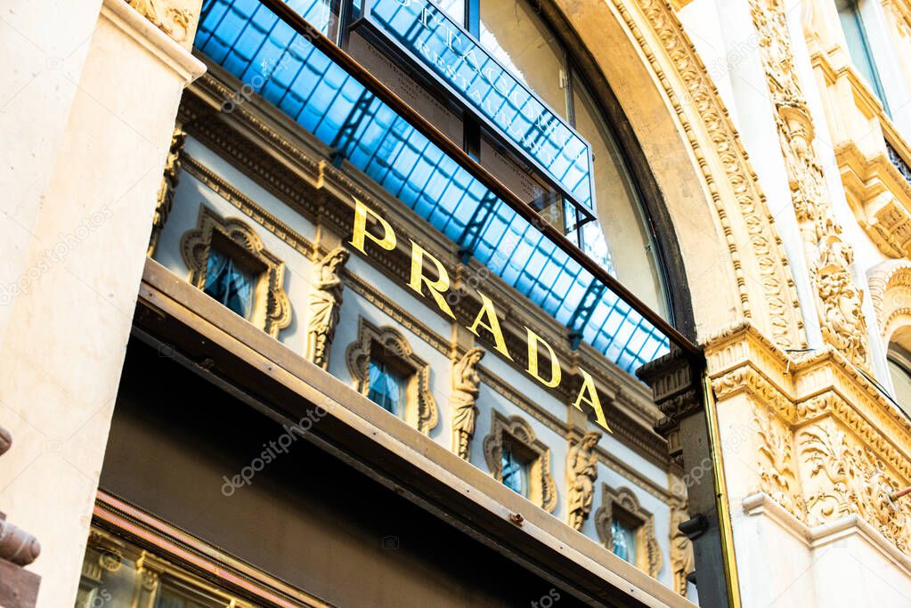 Milan, Italy, 20 December 2018:  Prada Store in Galleria Vittorio Emanuele II shopping mall in Milan, with shoppers and tourists strolling around. Prada is an Italian luxury fashion house founded in 1913