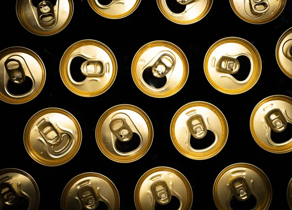 Abstract pattern of opened aluminium cans, top view. Excess drinking, consumerism, alcoholism, or \'be different\' concept