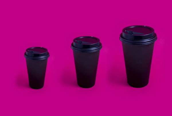 Черный Вынос Бумажной Чашки Кофе Различных Размеров Розовом Фоне Кофе — стоковое фото