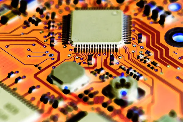 Abstract red computer circuit board close up for background