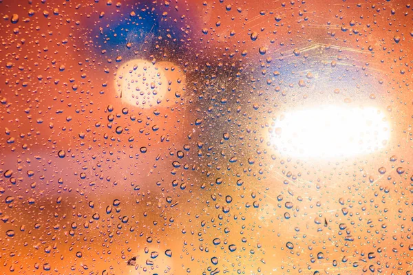 Bokeh gotas de lluvia desde la ventana — Foto de Stock