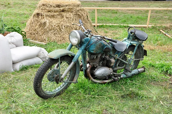 Old bike on the grass.