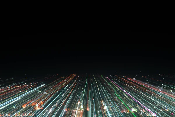 light lines with long exposure,  speed motion abstract background in the dark night ,  blast zoom effect , zoom burst of light in the city