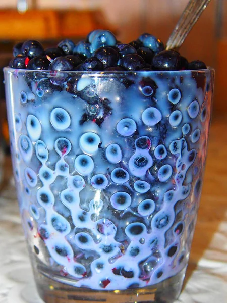 Blueberry with condensed milk — Stock Photo, Image