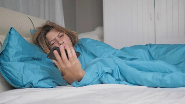 Really Sleeping Woman Wakes Up And Looks At The Phone Throws It And Falls Asleep Stock Picture