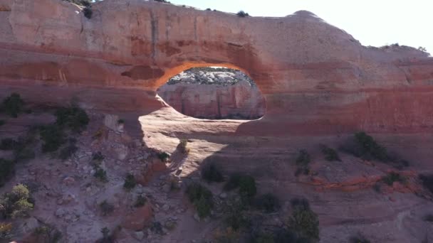 Drone Flies Through The Red Stone Arch With Massive Rock Formations — Stock Video