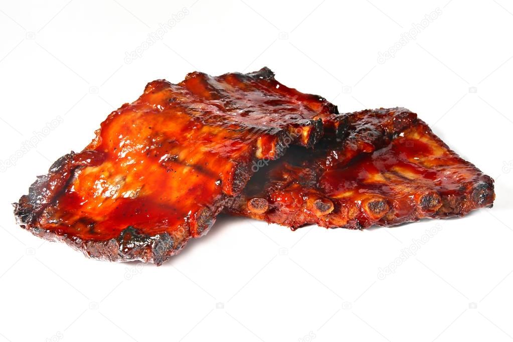 Grilled ribs isolated on white, shallow focus