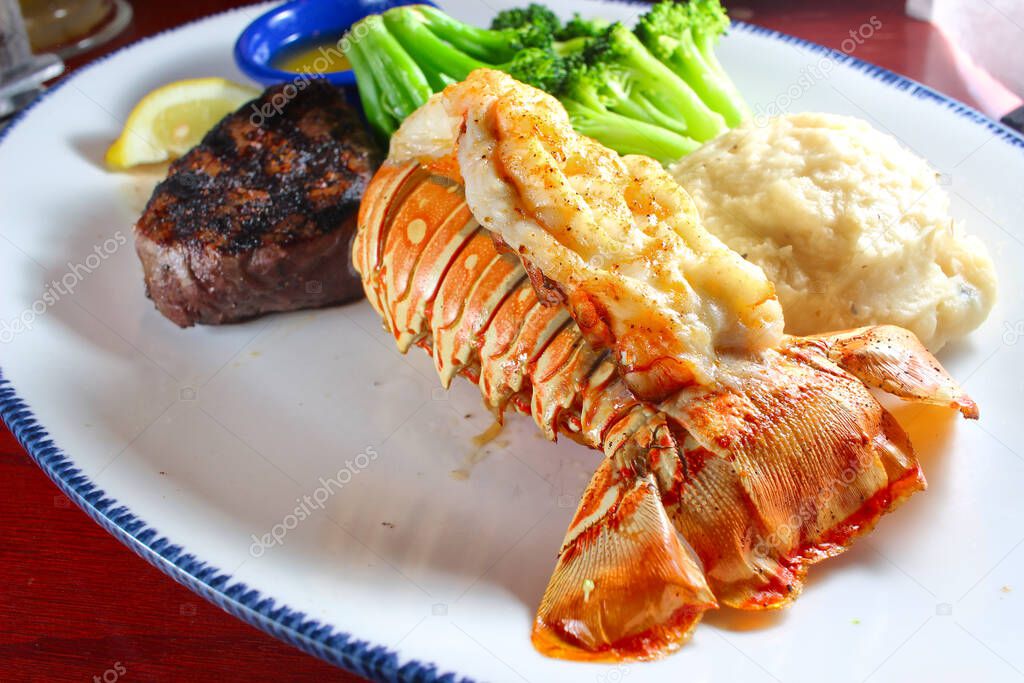 Turf and surf fillet mignon with lobster tail, shallow focus