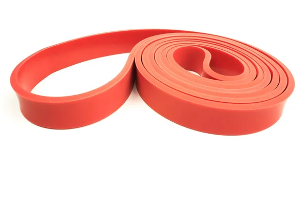 Red exercise resistance band — Stock Photo, Image