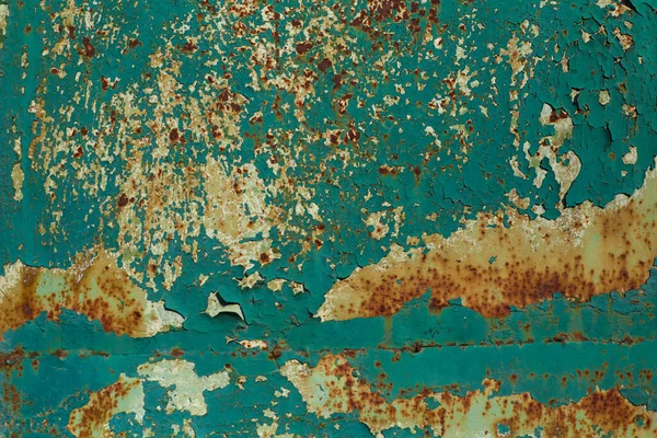 Structured surface of aged rusty wall with peeling turquoise paint — Stock Photo, Image
