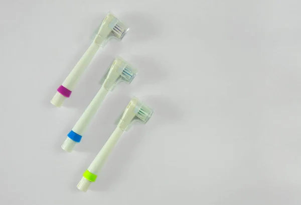 Set of heads of electric toothbrush. Concept of dental health ca — Stock Photo, Image