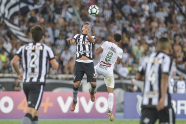 Rio, Brazil - november 04, 2017: Rodrigo Lindoso and Douglas player in match between Botafogo and  Fluminense by the Brazilian Championship in Nilton Santos Stadium