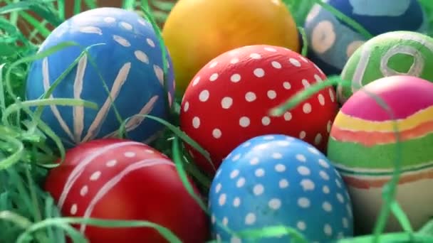 Painted Eggs Symbolizing Easter Straw Green Background — Stock Video