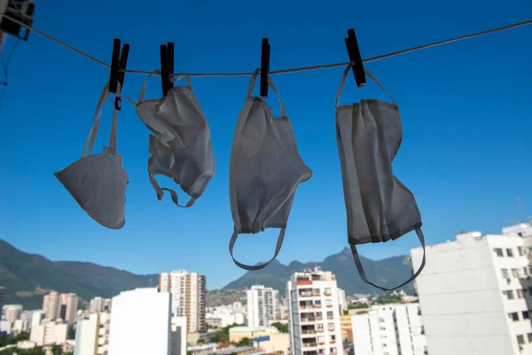 masks drying after washing to sterilize covid-9 in a apartment balcony