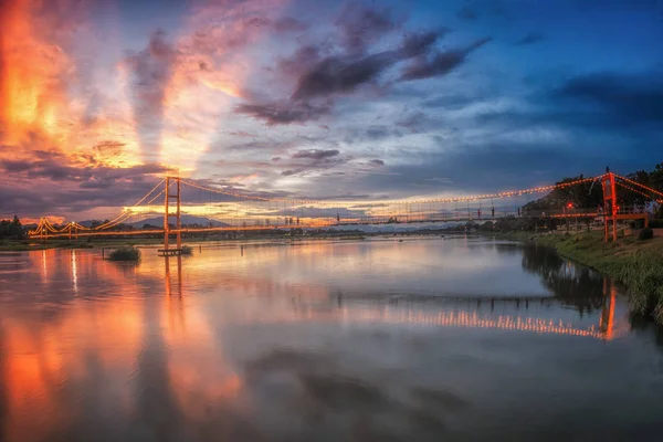Landscape of sunset  bridge crossing Ping river at Tak ,Thailand — Stock Photo, Image