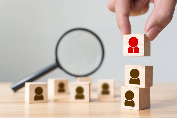 Human resource and talent management and recruitment business building team, Personal development of employee in organisation. Hand putting wood cube block on top, Copy space