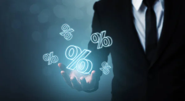 Interest rate financial and mortgage rates concept. Businessman hand show icon percent 3d sign — 图库照片