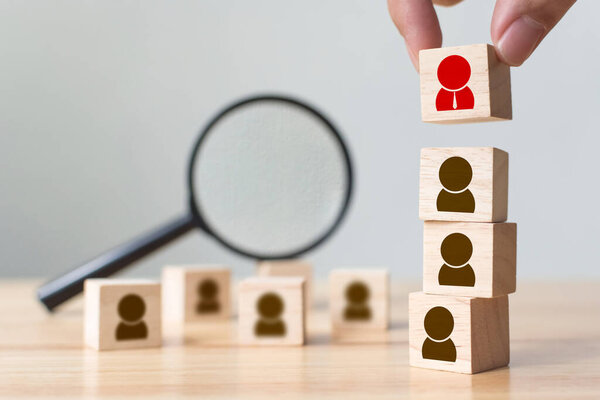 Human resource and talent management and recruitment business building team, Personal development of employee in organisation. Hand putting wood cube block on top, Copy space