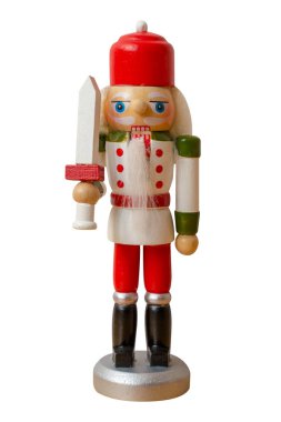 Noel fındıkkıran oyuncak asker figürü, beyaz arka planda izole edilmiş.