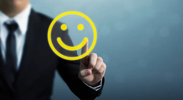 Customer service experience and business satisfaction survey. Businessman hand drawing smiley face
