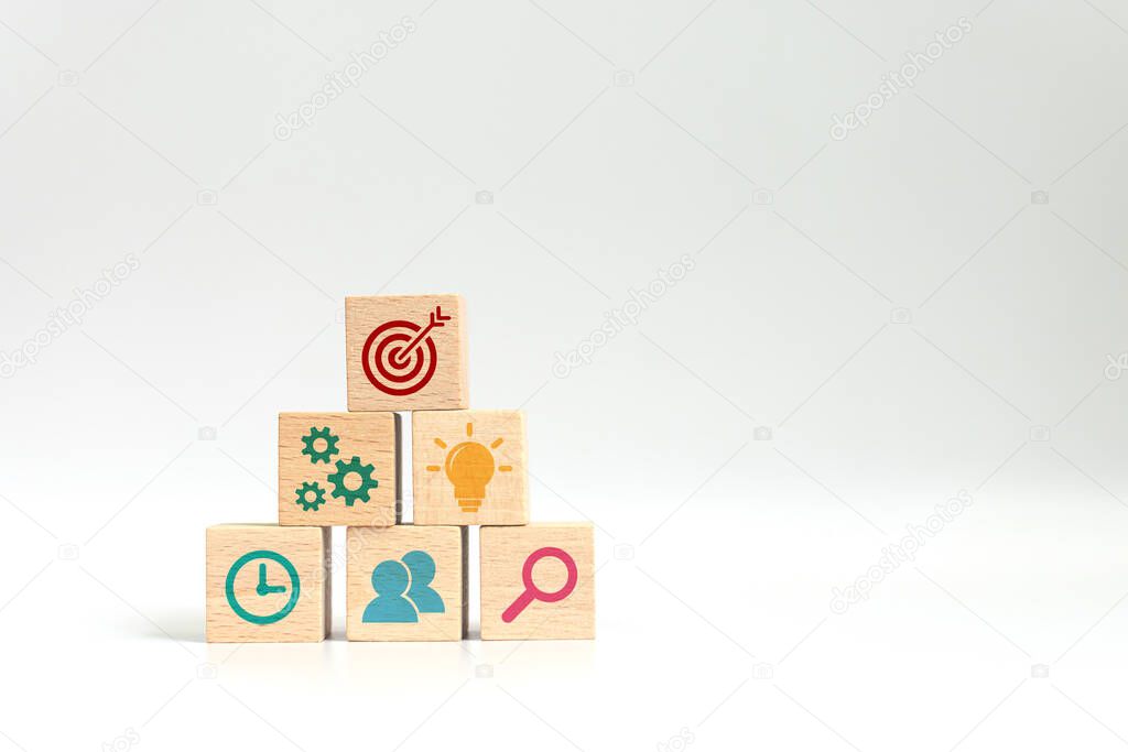 Concept of business strategy and action plan. Wood cube block stacking with icon on white background