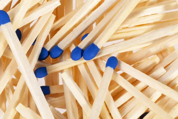 Heap of matches with blue heads isolated on white background — Stock Photo, Image