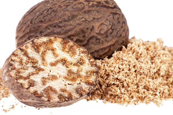 Nutmeg ,  half and ground on white background, close up — Stock Photo, Image