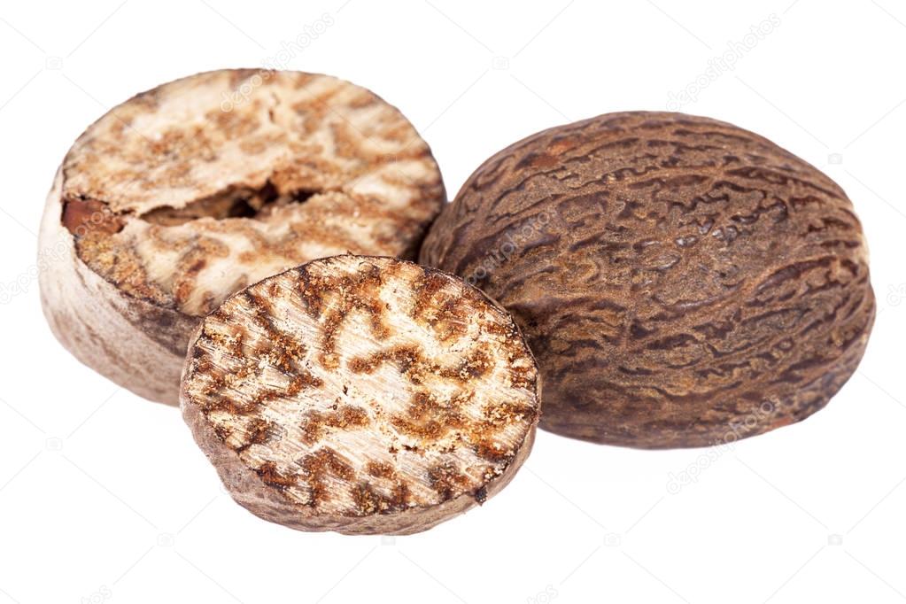 Nutmeg ,whole and  half isolated on white background, close up