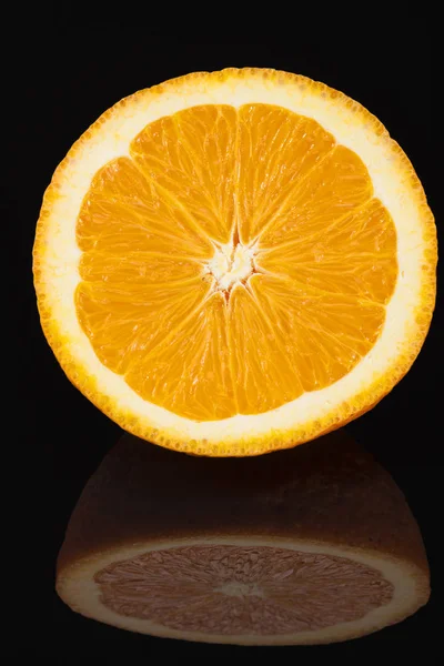 Fresh fruits  of mandarine isolated on black  background — Stock Photo, Image