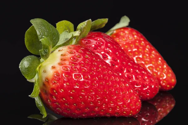 Fresh fruits of red strawberry isolated on black background — Stock Photo, Image