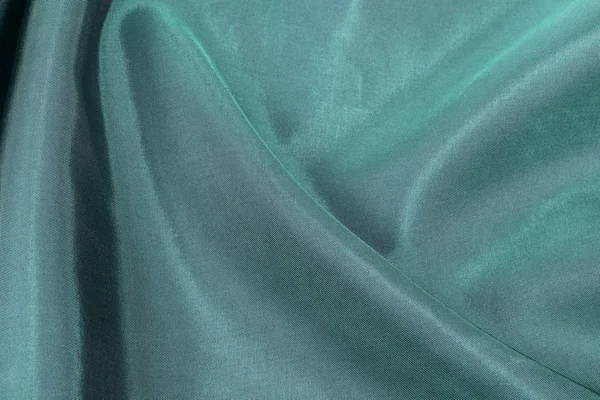 シルクの背景、緑の光沢のある生地のテクスチャ — ストック写真