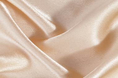 İpek arka plan, bej parlak kumaş dokusuna