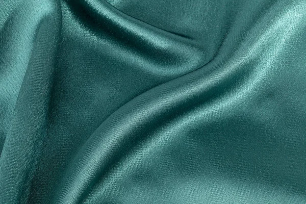Zijde achtergrond, textuur van groene glanzende stof, close-up — Stockfoto