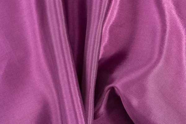 Silk bakgrund, konsistens av amarant färg glänsande tyg — Stockfoto