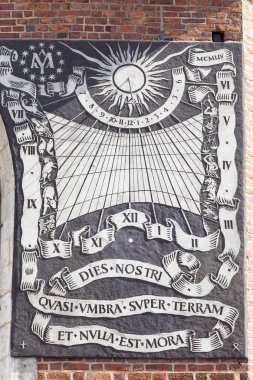 Sundial on the wall of St. Mary's Basilica  , Krakow, Poland clipart