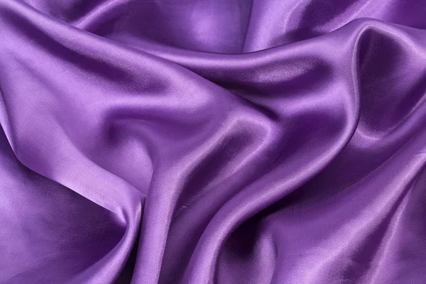 Silk bakgrund, textur av violett glänsande tyg, närbild — Stockfoto