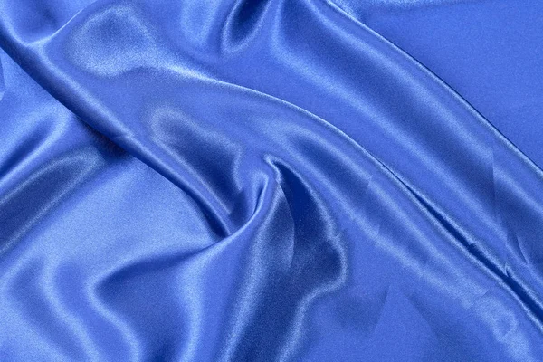 Zijde achtergrond, textuur van blauwe glimmende stof, close-up — Stockfoto